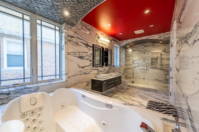 bathroom featuring vanity, a marble finish shower, a tub with jets, visible vents, and recessed lighting