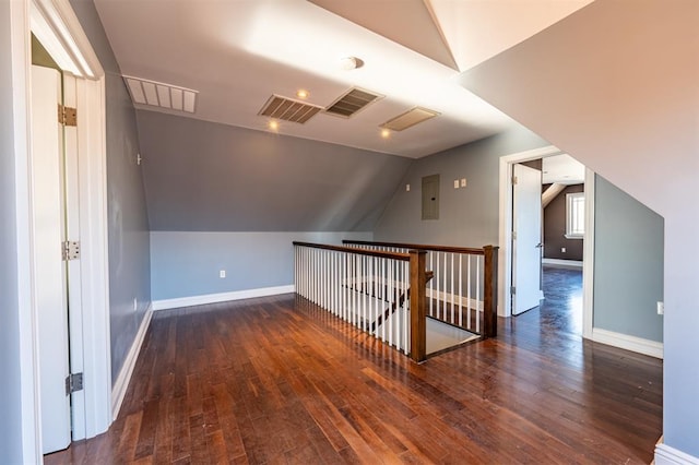 bonus room featuring hardwood / wood-style floors, baseboards, and visible vents