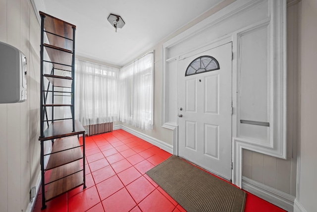 87 E 32nd St, Brooklyn, NY 11226 - foyer entrance with tile patterned floors, baseboards, and radiator