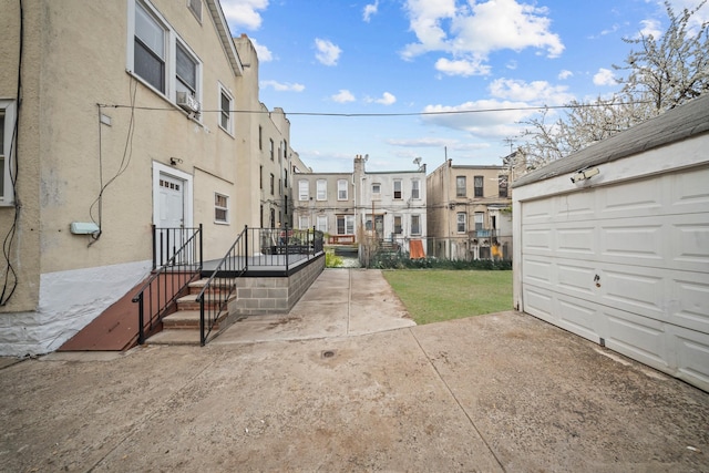 87 E 32nd St, Brooklyn, NY 11226 - view of community with driveway, a residential view, and a garage