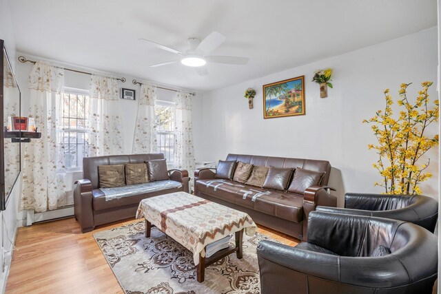 438 Shepherd Ave, Brooklyn, NY 11208 - living room with a baseboard radiator, ceiling fan, and light wood-style flooring