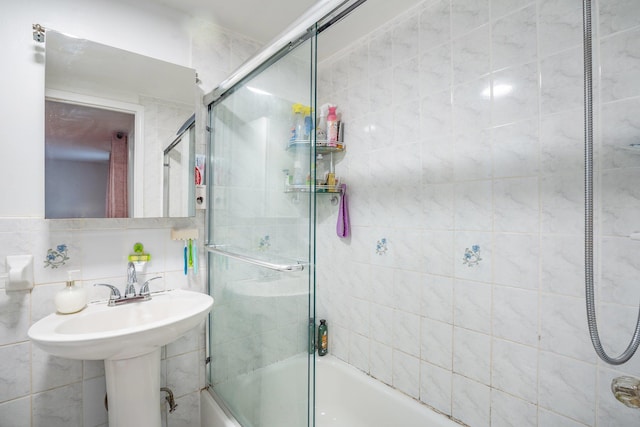 438 Shepherd Ave, Brooklyn, NY 11208 - bathroom featuring bath / shower combo with glass door and tile walls