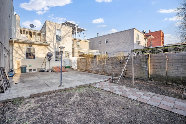 438 Shepherd Ave, Brooklyn, NY 11208 - fenced backyard with a patio area and a balcony