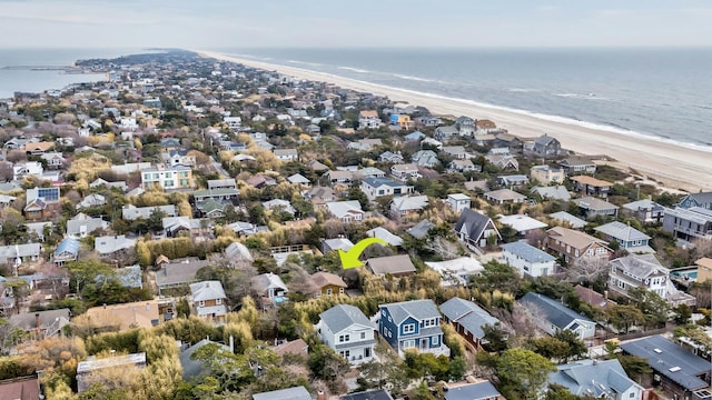 bird's eye view with a beach view, a residential view, and a water view
