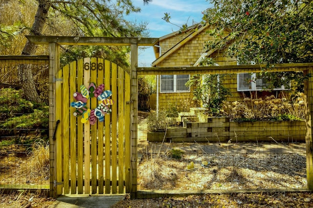 view of home's exterior featuring a gate