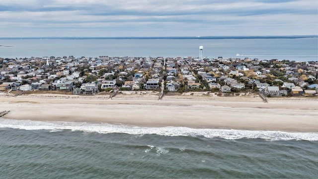 aerial view with a view of the beach, a residential view, and a water view