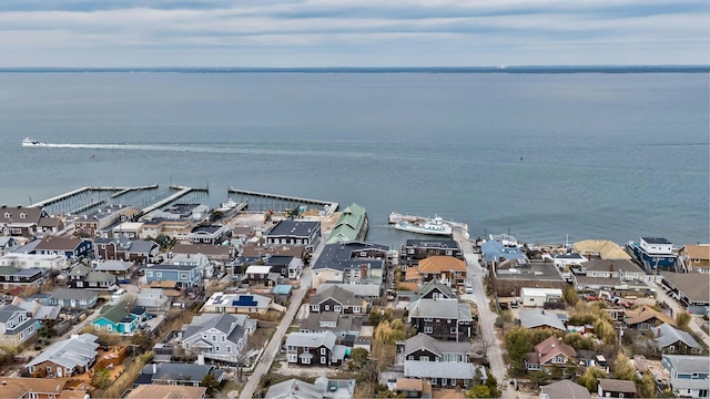 birds eye view of property with a water view and a residential view