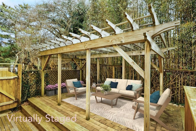 wooden deck featuring outdoor lounge area, fence, and a pergola