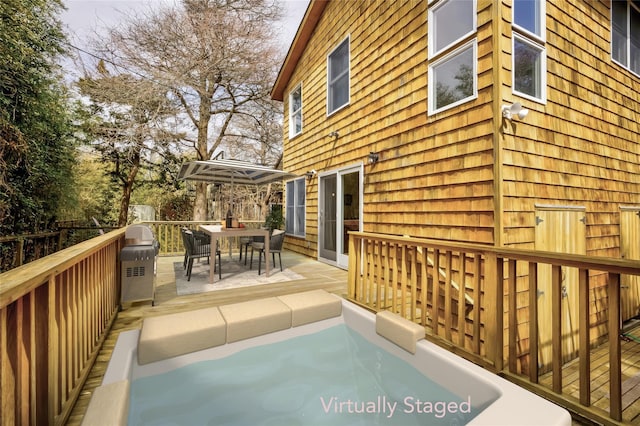 wooden deck featuring outdoor dining area