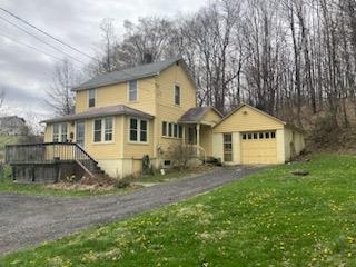 29 S Plank Rd, Westtown, NY 10998 - traditional-style home featuring aphalt driveway, a front yard, and a garage
