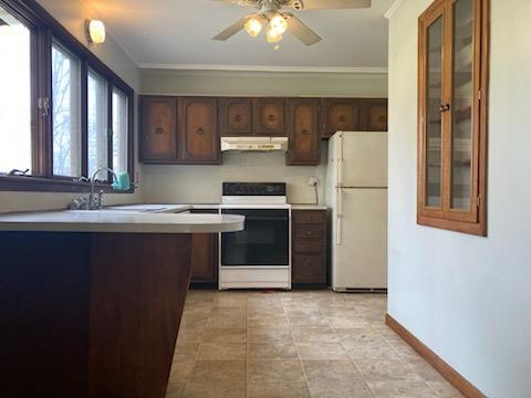 29 S Plank Rd, Westtown, NY 10998 - kitchen with a ceiling fan, electric range, baseboards, under cabinet range hood, and freestanding refrigerator