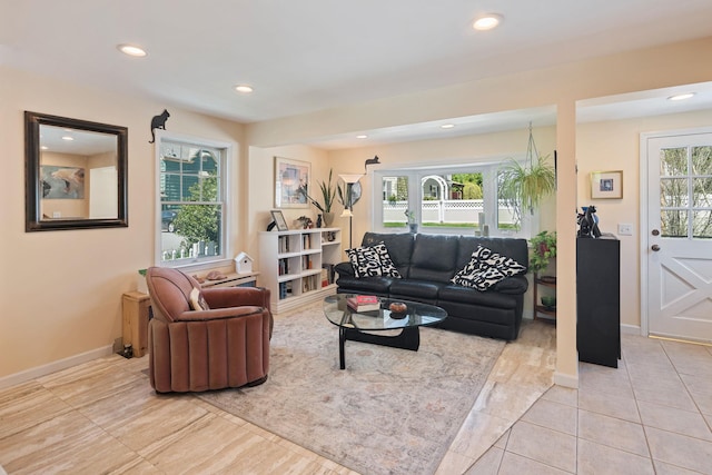 tiled living room featuring recessed lighting and baseboards