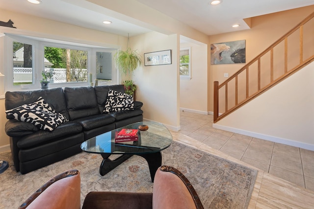 living area with recessed lighting, stairs, light tile patterned floors, and baseboards