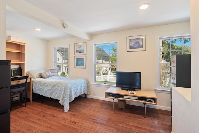 bedroom with baseboards, beam ceiling, recessed lighting, and wood finished floors