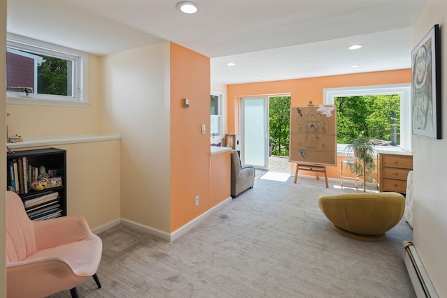 sitting room with baseboards, carpet, a baseboard heating unit, and recessed lighting