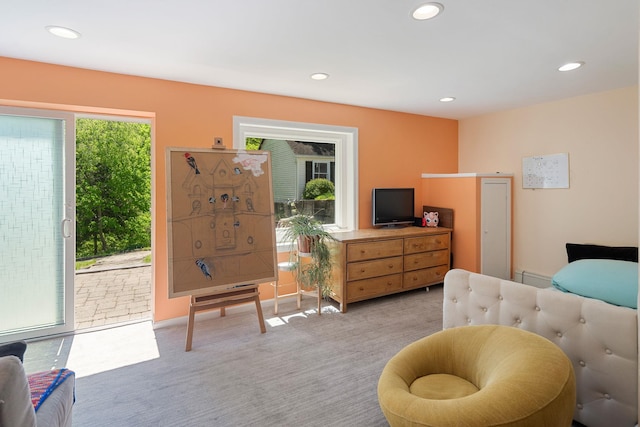bedroom with recessed lighting, light colored carpet, and access to exterior