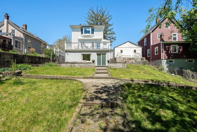 rear view of property featuring a yard