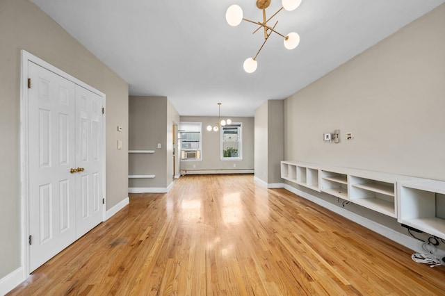 338 Hendrix St, Brooklyn, NY 11207 - unfurnished living room featuring light wood-style flooring, baseboards, a notable chandelier, and a baseboard radiator