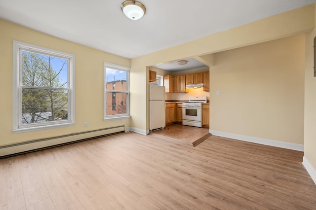 338 Hendrix St, Brooklyn, NY 11207 - unfurnished living room featuring baseboards, light wood-style flooring, and baseboard heating
