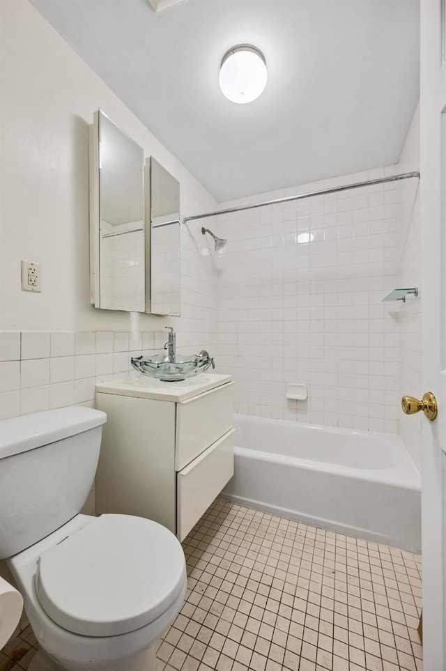 338 Hendrix St, Brooklyn, NY 11207 - full bath with toilet, tile walls, bathtub / shower combination, tile patterned flooring, and vanity
