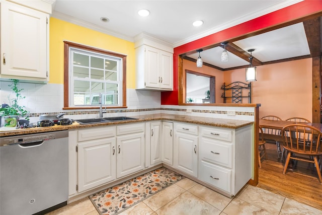 kitchen featuring tasteful backsplash, stainless steel dishwasher, ornamental molding, and a sink