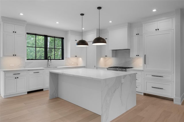 466 Montauk Hwy, Westhampton Beach, NY 11978 - kitchen featuring a center island, light wood-type flooring, white cabinets, and recessed lighting
