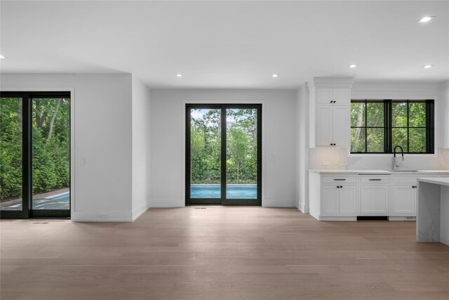 466 Montauk Hwy, Westhampton Beach, NY 11978 - unfurnished dining area with light wood finished floors and recessed lighting