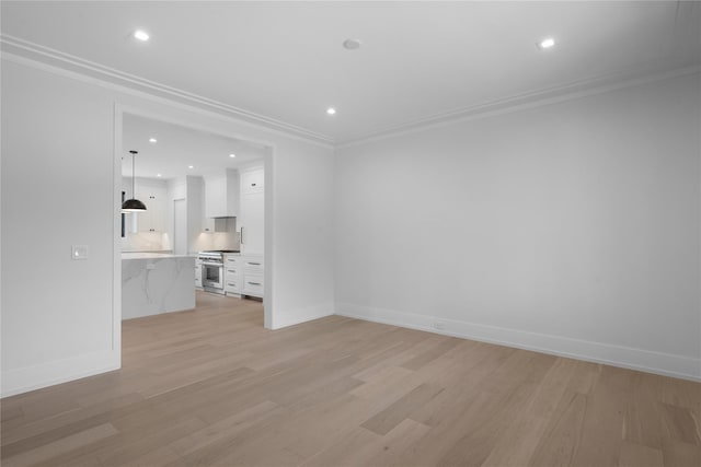 466 Montauk Hwy, Westhampton Beach, NY 11978 - unfurnished living room with light wood-type flooring, recessed lighting, and ornamental molding