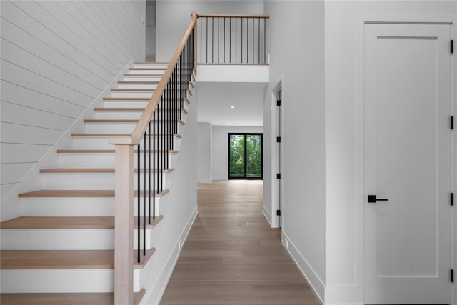 466 Montauk Hwy, Westhampton Beach, NY 11978 - stairway featuring wood finished floors and a towering ceiling