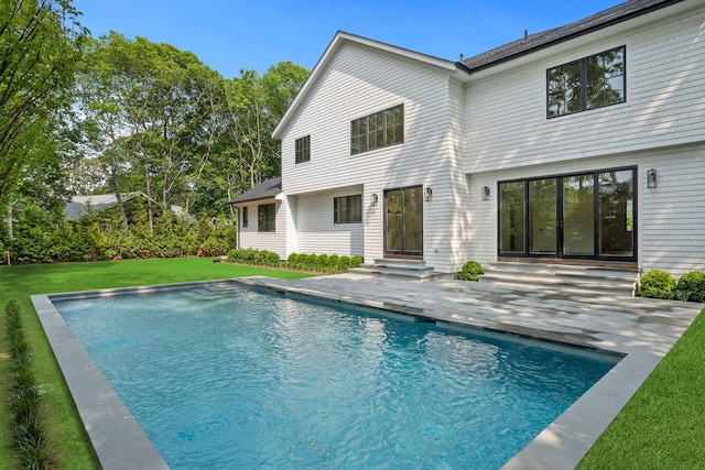 466 Montauk Hwy, Westhampton Beach, NY 11978 - back of property featuring a patio, entry steps, a lawn, and an outdoor pool