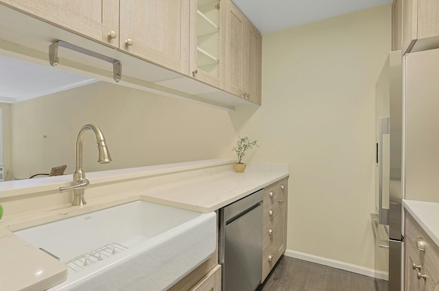 500 Pondside Dr Unit 2E, White Plains, NY 10607 - kitchen with a sink, appliances with stainless steel finishes, dark wood-style floors, light brown cabinetry, and baseboards