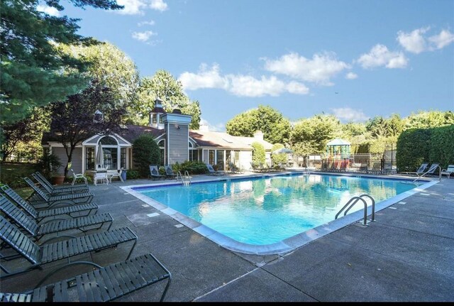 500 Pondside Dr Unit 2E, White Plains, NY 10607 - community pool featuring a patio area