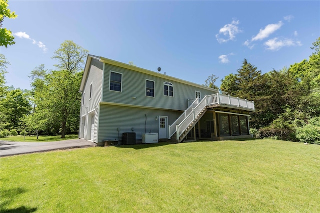 19 Old Bulls Head Rd, Rhinebeck, NY 12572 - rear view of property with stairs, an attached garage, central air condition unit, a wooden deck, and asphalt driveway