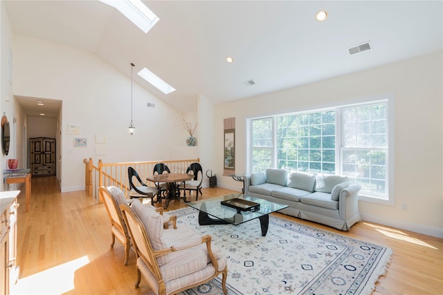 19 Old Bulls Head Rd, Rhinebeck, NY 12572 - living room with a skylight, light wood-style flooring, baseboards, high vaulted ceiling, and recessed lighting
