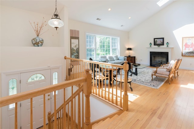 19 Old Bulls Head Rd, Rhinebeck, NY 12572 - living area with light wood-type flooring, a fireplace with flush hearth, high vaulted ceiling, and recessed lighting