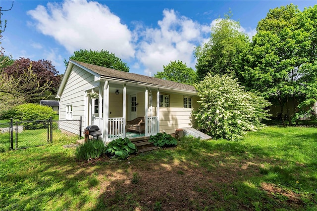 49 Lorraine Dr, Rhinebeck, NY 12572 - view of front facade with a porch and a gate