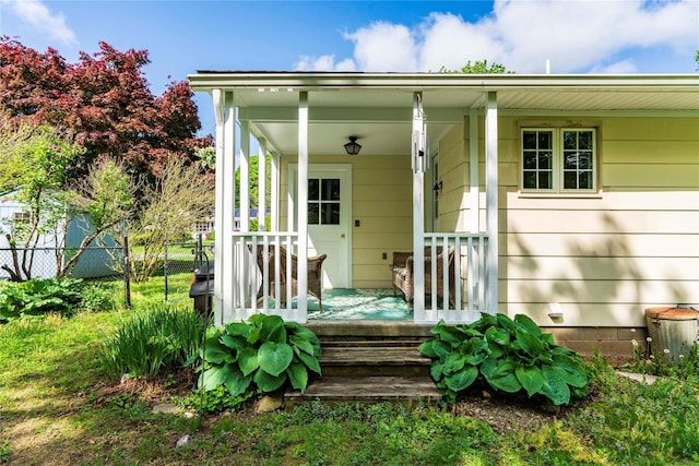 49 Lorraine Dr, Rhinebeck, NY 12572 - view of exterior entry with covered porch and fence