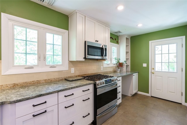49 Lorraine Dr, Rhinebeck, NY 12572 - kitchen featuring appliances with stainless steel finishes, decorative backsplash, healthy amount of natural light, and recessed lighting