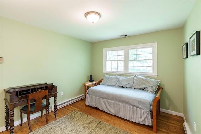 49 Lorraine Dr, Rhinebeck, NY 12572 - bedroom featuring wood finished floors, baseboard heating, and baseboards