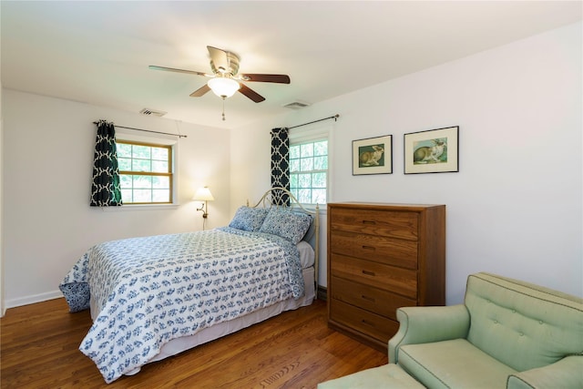 49 Lorraine Dr, Rhinebeck, NY 12572 - bedroom featuring multiple windows, wood finished floors, and ceiling fan