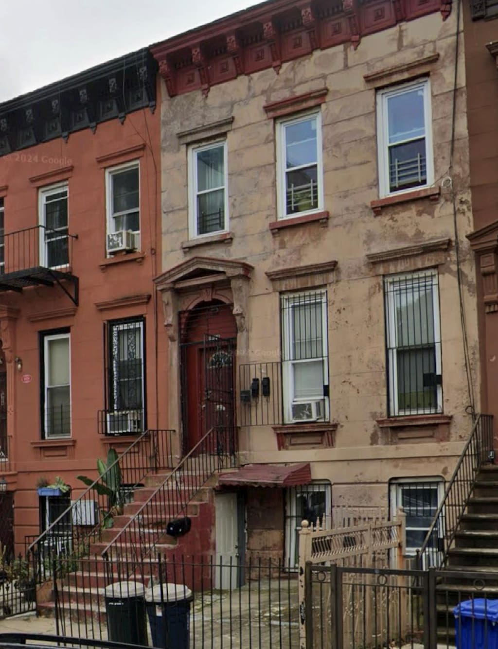 1022 Greene Ave, Brooklyn, NY 11221 - townhome / multi-family property with cooling unit, a fenced front yard, and stairs