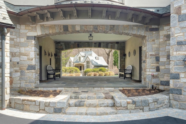 24 Penwood Rd, Bedford Corners, NY 10549 - doorway to property with stucco siding and stone siding