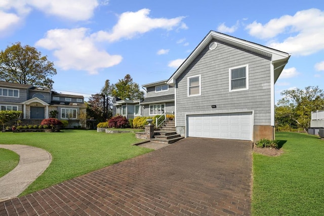 view of front of property with an attached garage, a front lawn, and decorative driveway