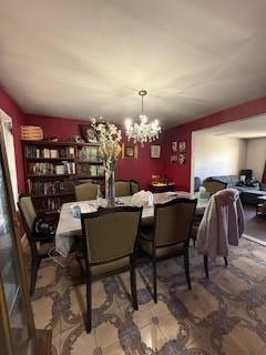 dining area with a notable chandelier