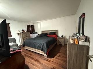 bedroom with wood finished floors