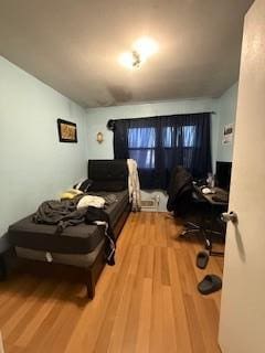 bedroom featuring wood finished floors