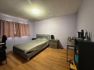 bedroom featuring light wood-style floors