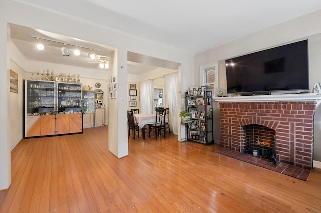unfurnished living room with a fireplace and hardwood / wood-style flooring