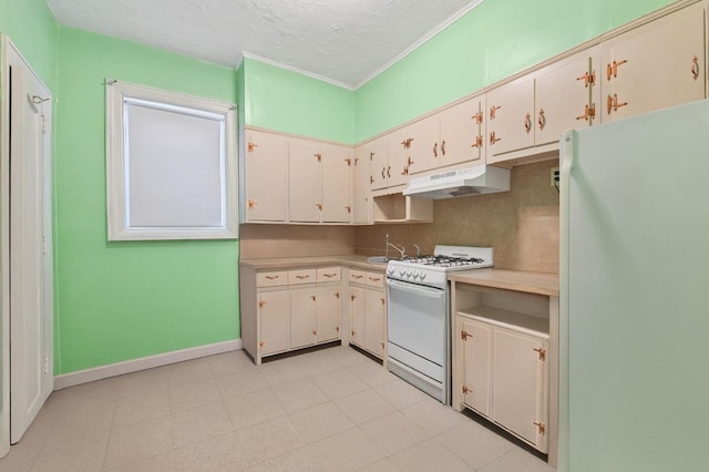 kitchen featuring white appliances, ornamental molding, under cabinet range hood, light countertops, and baseboards