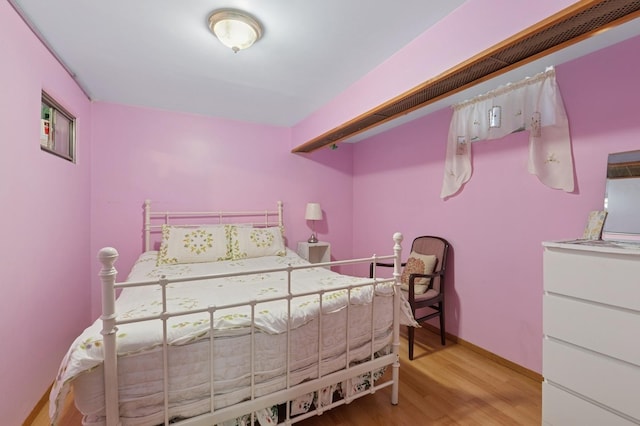 bedroom featuring wood finished floors